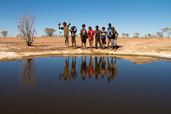 children playing at the lake.